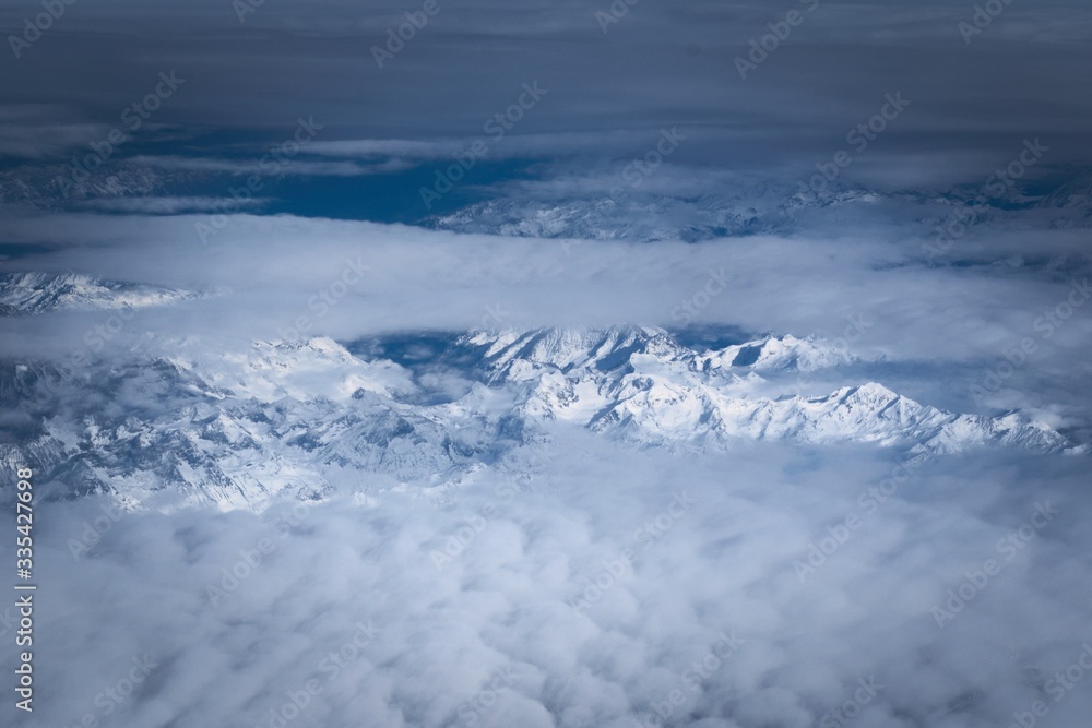 Snowy mountains in the Italian alps. Aerial, high altitude view.