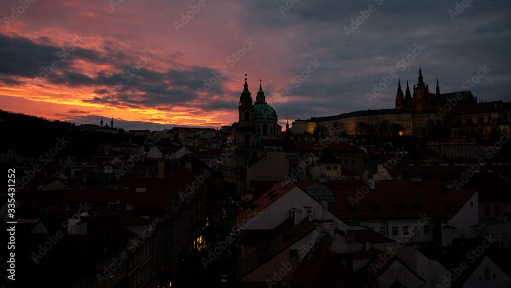 prague castle at night while the sun is setting