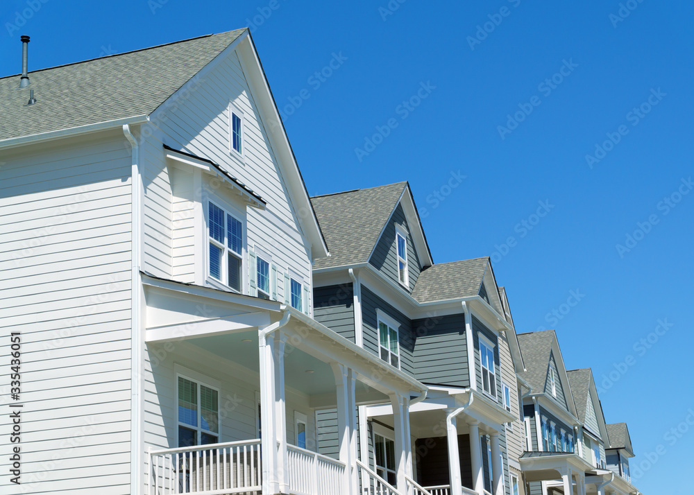 Residential homes roofs with blue sky