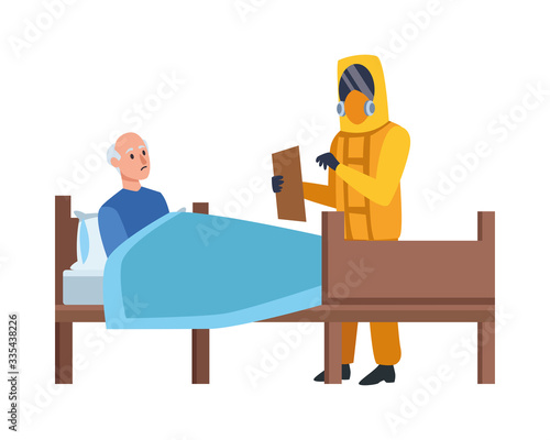 doctor with biosafety suit attending old man in bed