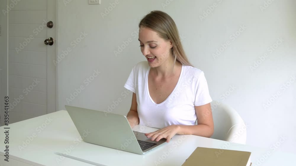 Woman using notebook computer laptop for email and online shopping at home Woman using notebook computer laptop for email and online shopping at home