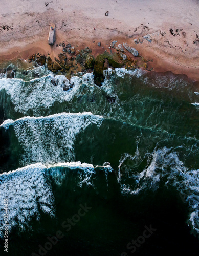 drone shot of the waves on the shore