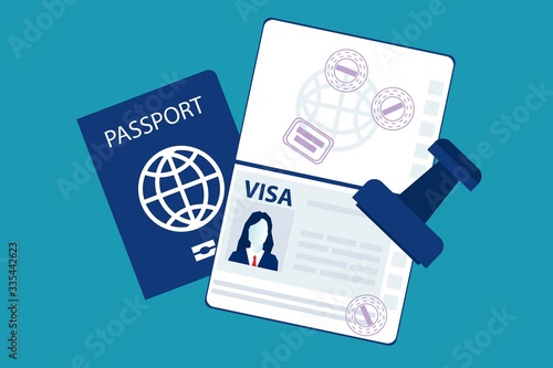 Passport with biometric data and visa stamps on it isolated on blue photo