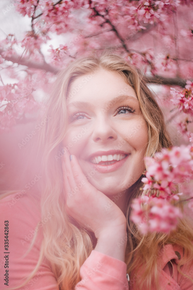 Girl in a cherry blossom garden Girl in a cherry blossom garden