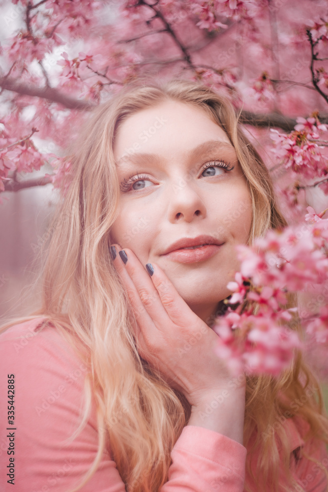 Girl in a cherry blossom garden Girl in a cherry blossom garden