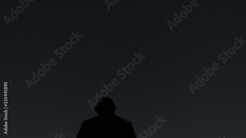 silhouette of a man walking in the night