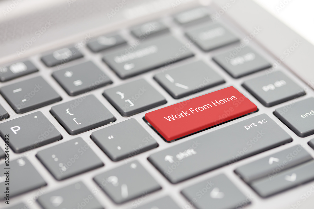 Work from home concept shown on close up enter key on notebook keyboard Work from home concept shown on close up enter key on notebook keyboard