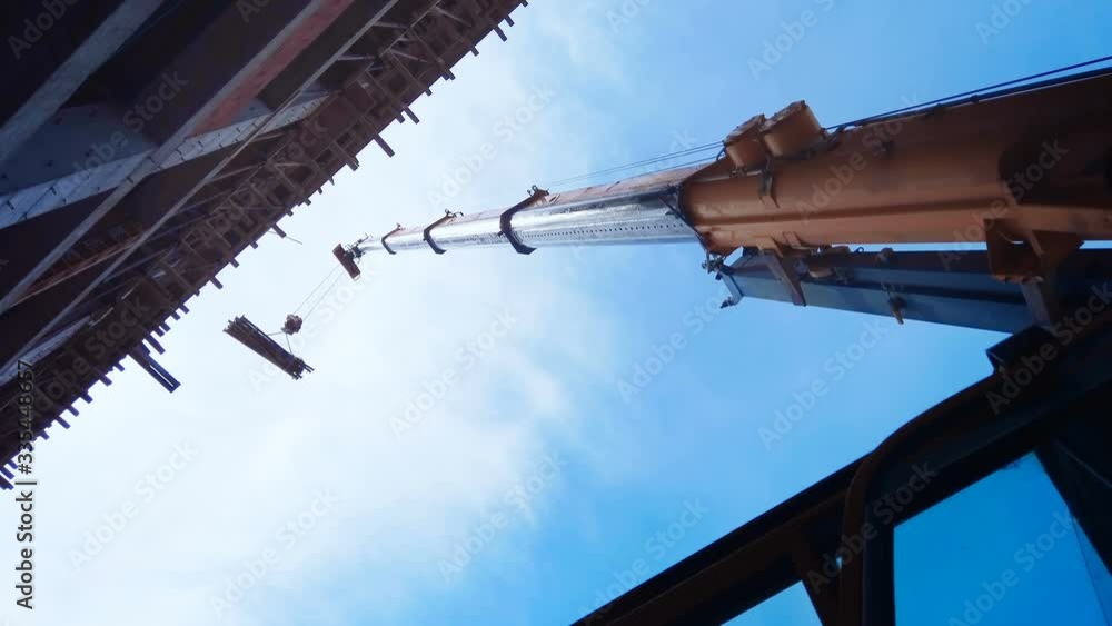 Telescopic arm of a mobile crane on building construction site