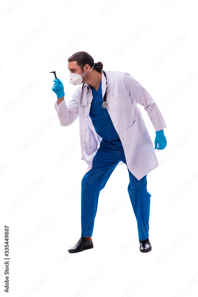 Young male medic in coronavirus concept isolated on white Young male medic in coronavirus concept isolated on white