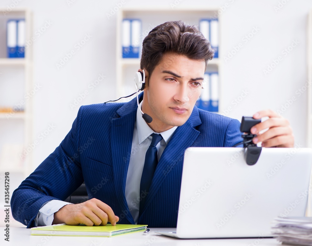 Young help desk operator working in office Young help desk operator working in office