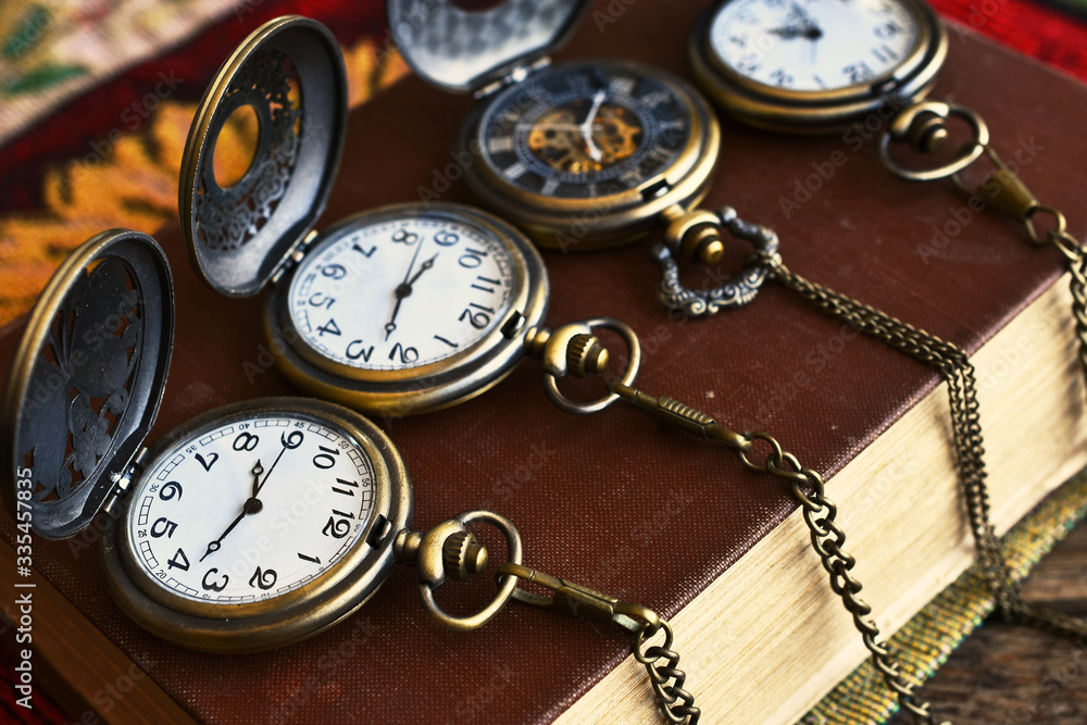 Four Vintage Pocket Watches and Antique Book