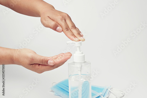 hand pump alcohol gel in bottle for cleaning coronavirus covid 19 on white background