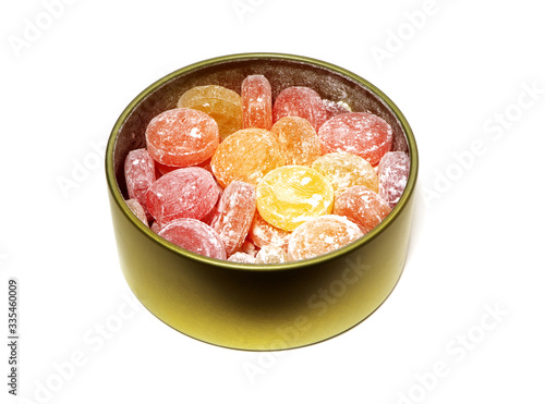 Candies in a metal box isolated on a white background. Sweets.