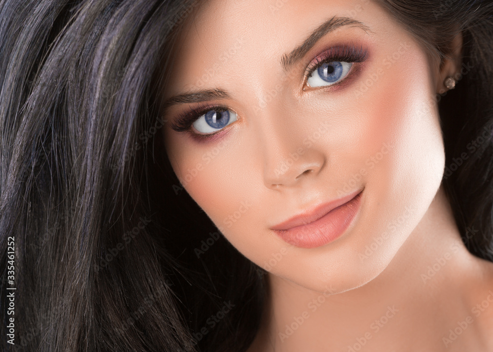 Close up beauty portrait of a blue eyed woman.