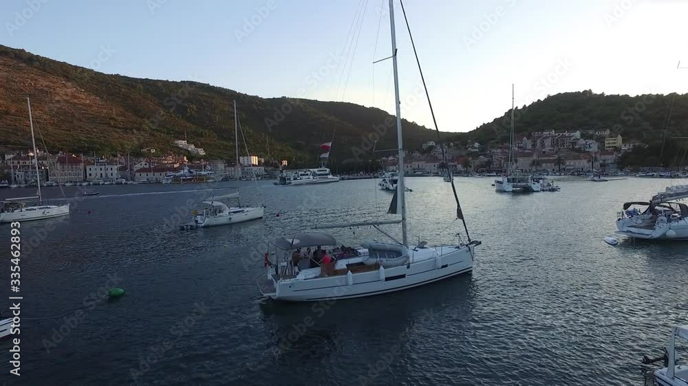 Port for yachts, pier, stand yachts, evening. Aerial view of a drone Port for yachts, pier, stand yachts, evening. Aerial view of a drone