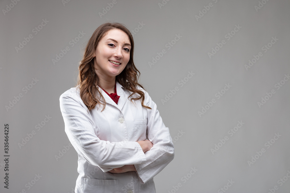 Confident friendly woman doctor or nurse in a coat Confident friendly woman doctor or nurse in a coat