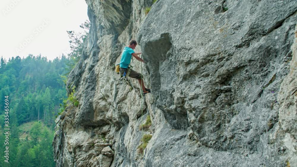 Man Climbs Up Natural Rock Formation. Extreme Sports Action. Man Climbs Up Natural Rock Formation. Extreme Sports Action.