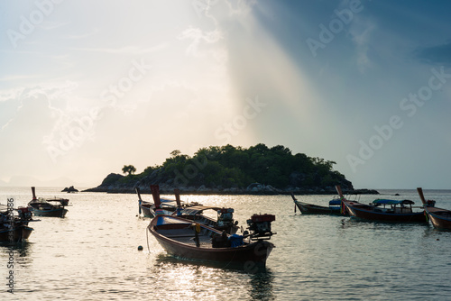 Fisery wooden boat sunrise morning with colorful sky