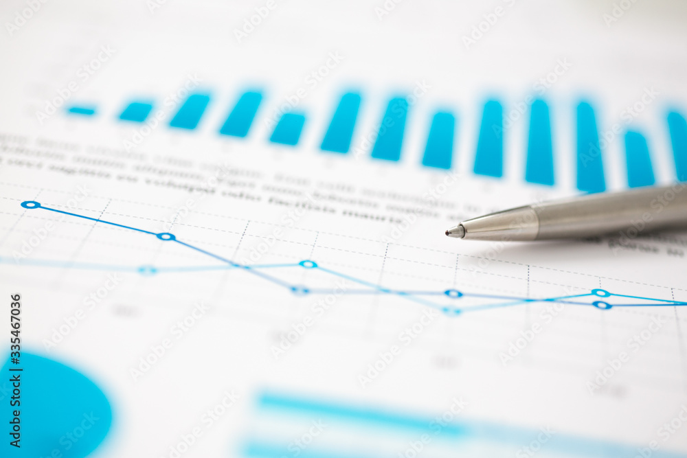 Financial statistics documents ball pen infographics at office table closeup. Internal Revenue Service inspector sum check, investigation, exchange market, earnings, savings, loan and credit concept Financial statistics documents ball pen infographics at office table closeup. Internal Revenue Service inspector sum check, investigation, exchange market, earnings, savings, loan and credit concept