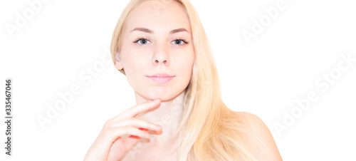 Natural looking blue  eye young woman beauty portrait, studio shot, blonde, long hair. Confidence girl.Fresh Skin.