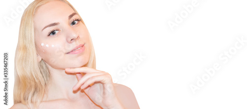 Face cream woman applying skin cream under eyes. Beauty eye contour cream, anti-aging skin care cream. Beautiful young female beauty model.
