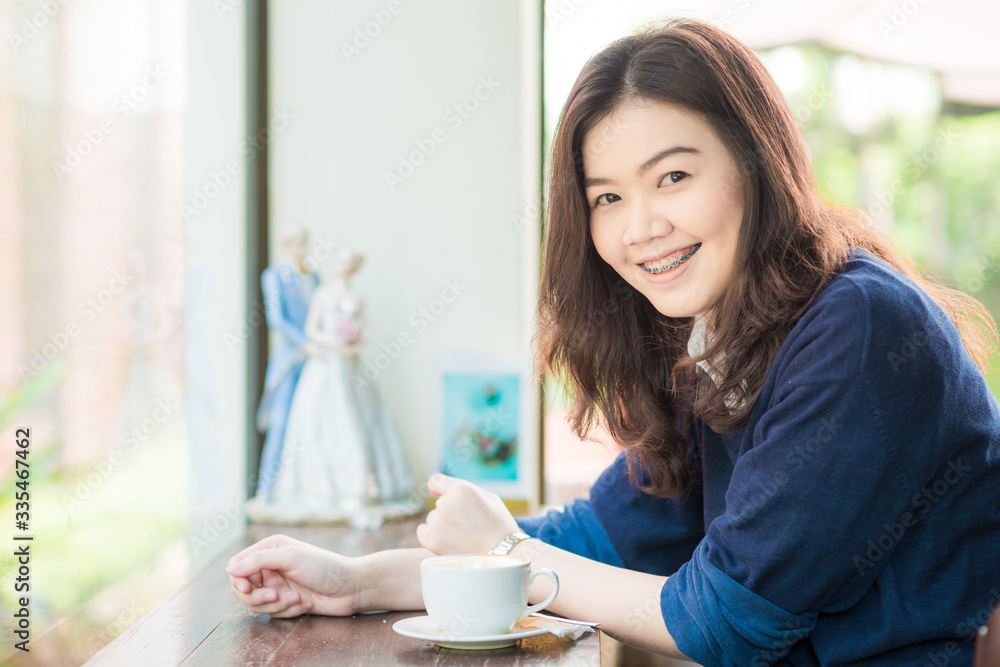 Business asian smart women drinking hot latte coffee and read book on couch Business asian smart women drinking hot latte coffee and read book on couch