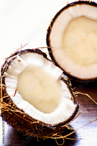 coconut cut into two pieces stock photo