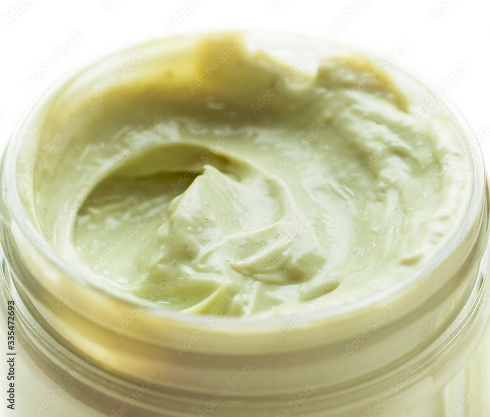 A natural ingredients body cream or mask in a jar on white background. Skin care, spa and clean cosmetic concept. Health and beauty. Close-up A natural ingredients body cream or mask in a jar on white background. Skin care, spa and clean cosmetic concept. Health and beauty. Close-up