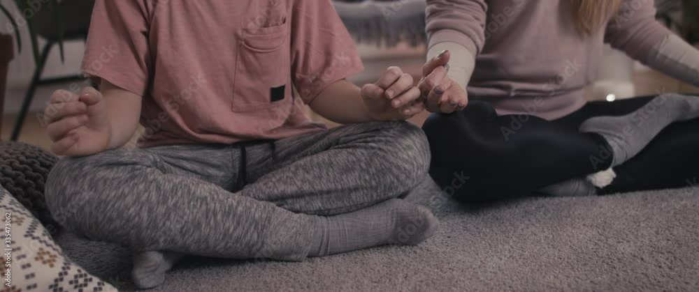 Mother and son enjoying meditating family time during coronavirus covid 19 pandemic outbreak wellbeing staying home in isolation Mother and son enjoying meditating family time during coronavirus covid 19 pandemic outbreak wellbeing staying home in isolation