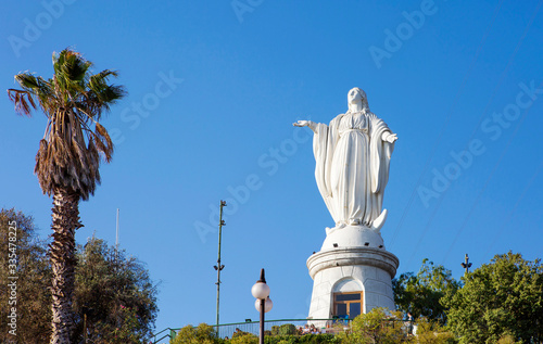 Santiago, Chile, Statue of the virgin Mary on the hill of San Cristobal. The snow-white statue of the Holy virgin Mary, considered the patroness of the townspeople, stands on the very top of the rock