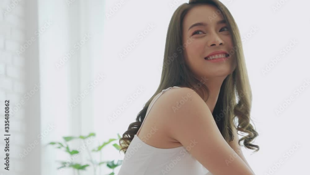 Portrait ot beautiful attractive asian young woman smile and hug pillow after wake up in the morning,So fresh and happiness on bed in cozy bedroom,Health care concept Portrait ot beautiful attractive asian young woman smile and hug pillow after wake up in the morning,So fresh and happiness on bed in cozy bedroom,Health care concept