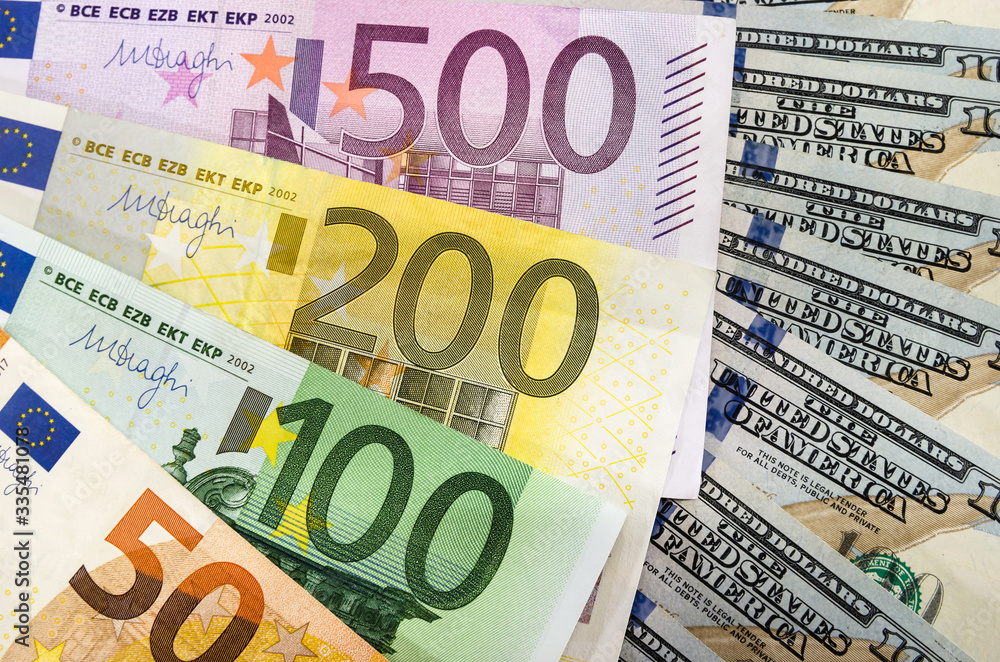 Euro and dollars close up. delicate background. Euro and dollars close up. delicate background.