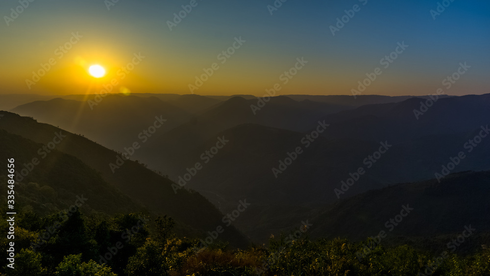 Sunset in the mountain valleys during the golden hour