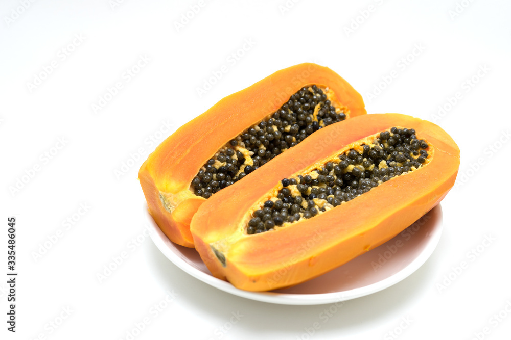 Papaya fruit peel in a plate on white background Papaya fruit peel in a plate on white background
