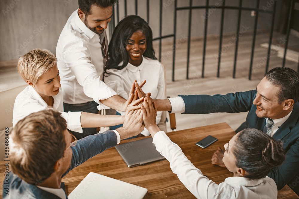 High Five Of Business Colleagues Join Hands Together High Five Of Business Colleagues Join Hands Together