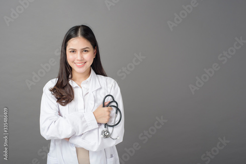 Smart woman doctor is holding stethoscope