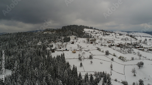 Aerial view over rural winter place