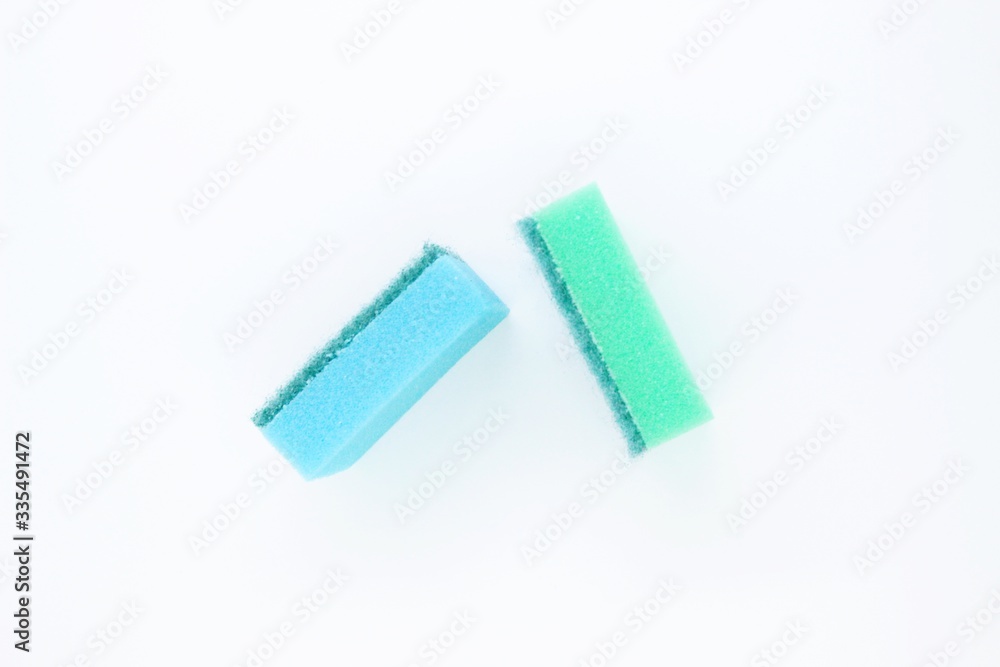 Multi-colored dishwashing sponges are placed on a white background Multi-colored dishwashing sponges are placed on a white background