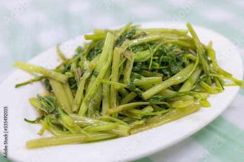 Fried water spinach dishes in restaurant