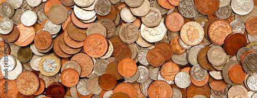 British currency, hundreds of copper and silver coloured coins piled randomly on top of each other, one pond coin, fifty pence, twenty pence, ten pence, five pence, two pence, one pence