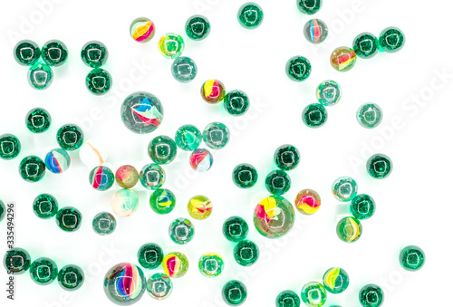 Fototapeta Naklejka Na Ścianę i Meble -  glass balls of various colors and sizes on white background