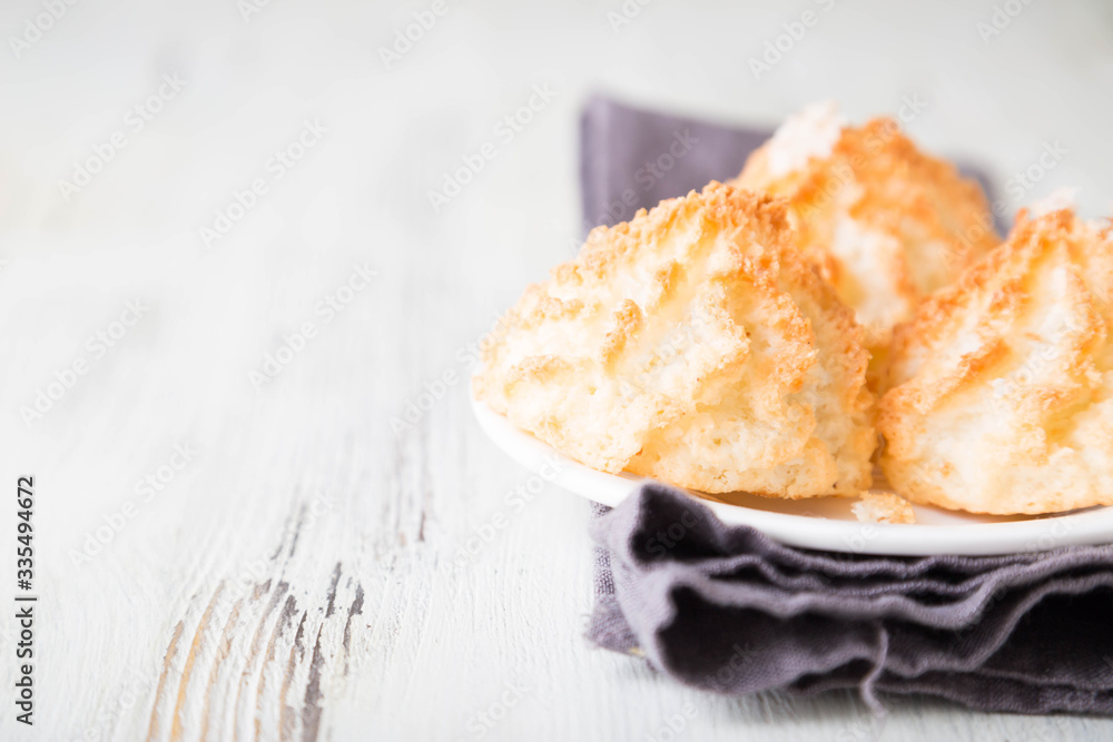 Homemade coconut cookies on a white table Homemade coconut cookies on a white table