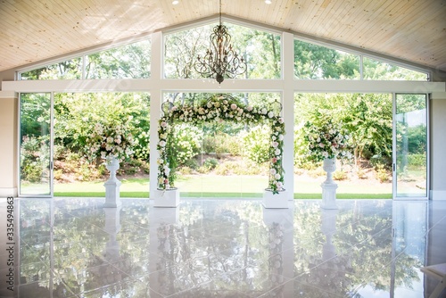Slika na platnu Shot of a beautiful decorated spacy white wedding hall