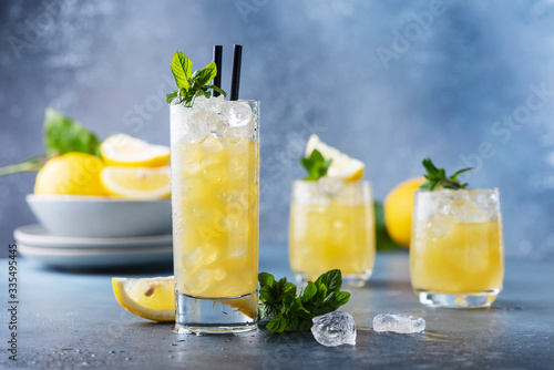 Fresh summer cocktail with lemons
