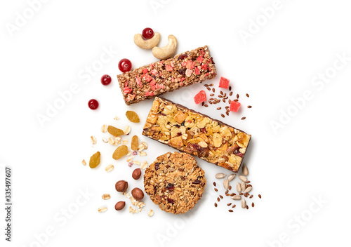 Granola bar with nuts and dry fruit berries. Energy cereal healthy snack. Fitness diet food. Protein muesli bars isolated on white background. Sport oatmeal bar, top view