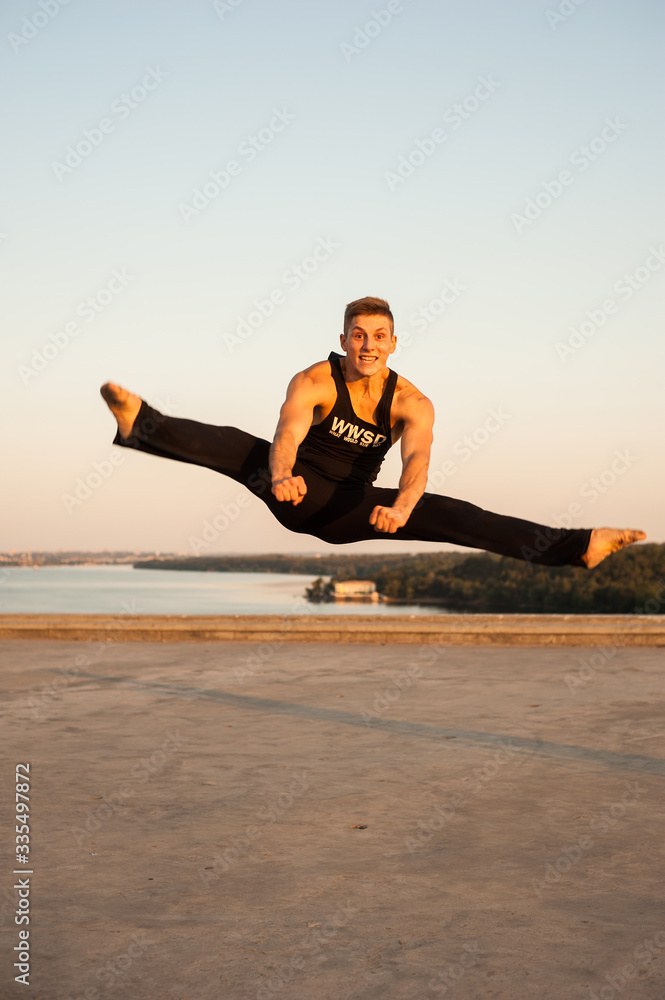 man dancer while dancing in the summer outdoors man dancer while dancing in the summer outdoors