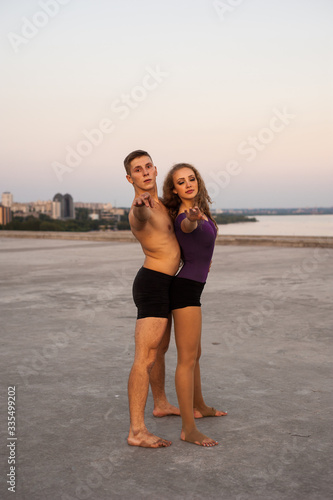 girl and guy dancers perform a passionate dance together outdoors in nature © Alla
