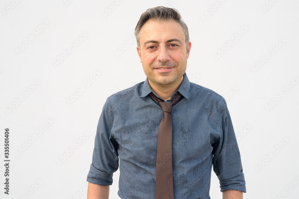 Fototapeta premium Portrait of happy mature handsome businessman smiling