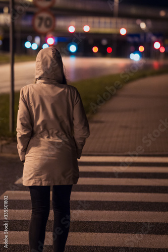 girl walking at night in the city