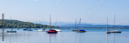 Panorama view of Lake Ammersee with anchoring sailboats
